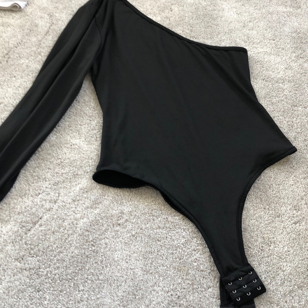 Black one shoulder body suit